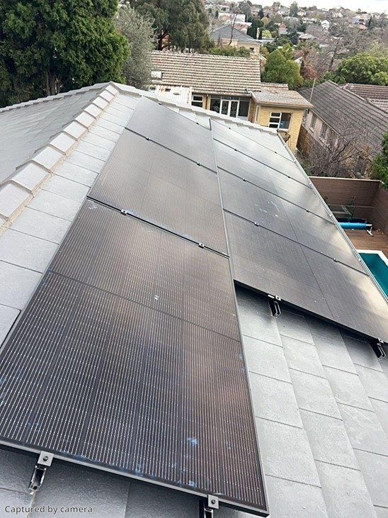 Aerial view of jinko tiger neo iii panels across the tiled north roof of daryl's balwyn north home
