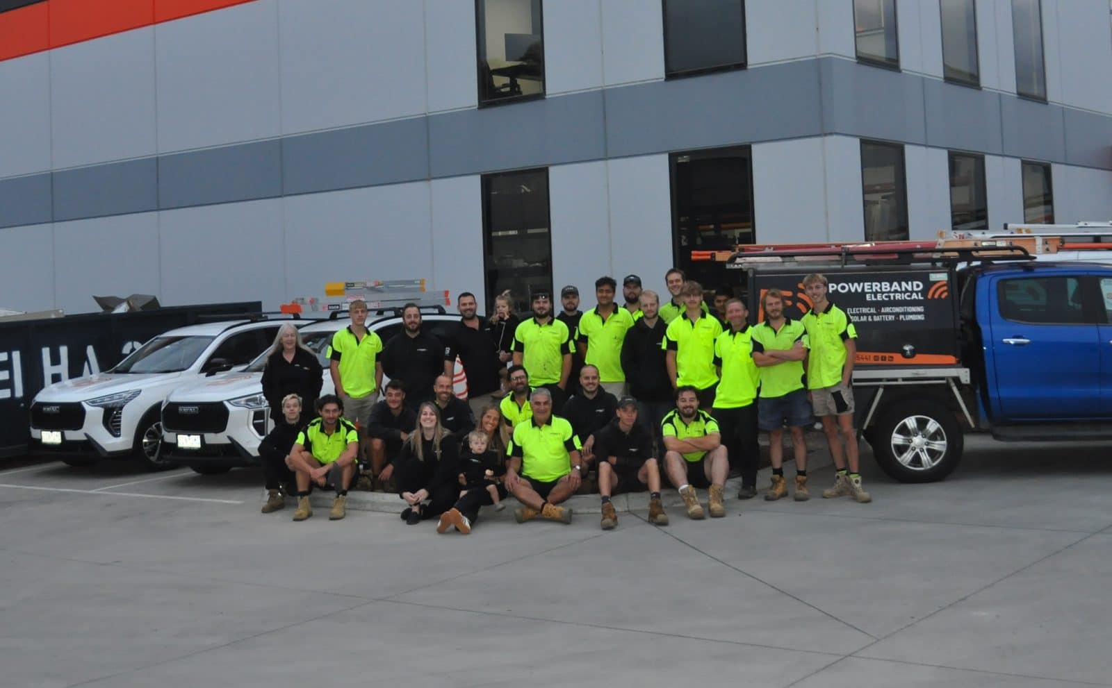 Powerband electrical team and van fleet outside the somerville office