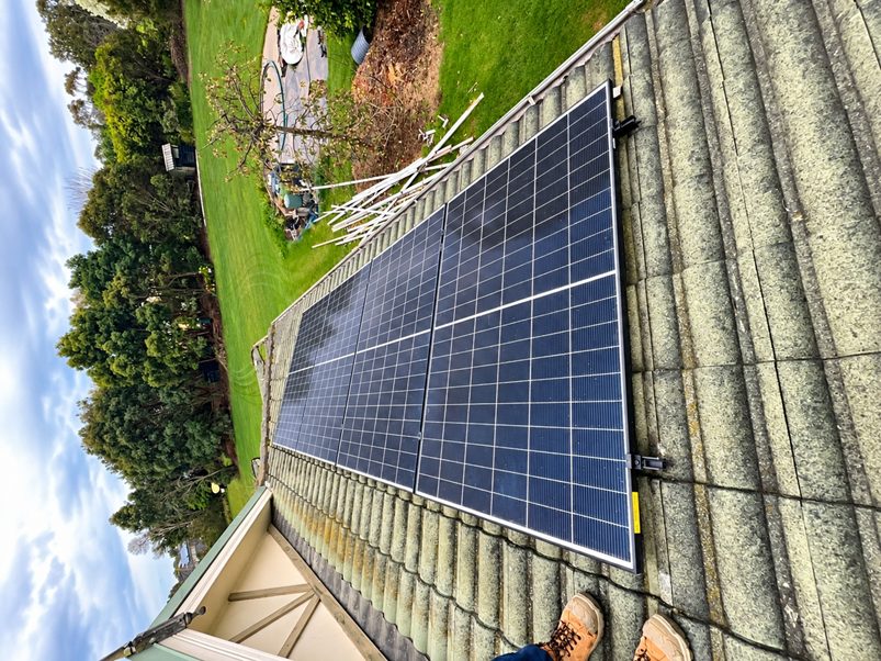 Pre-existing solar panels on the tile roof of steven's bittern home