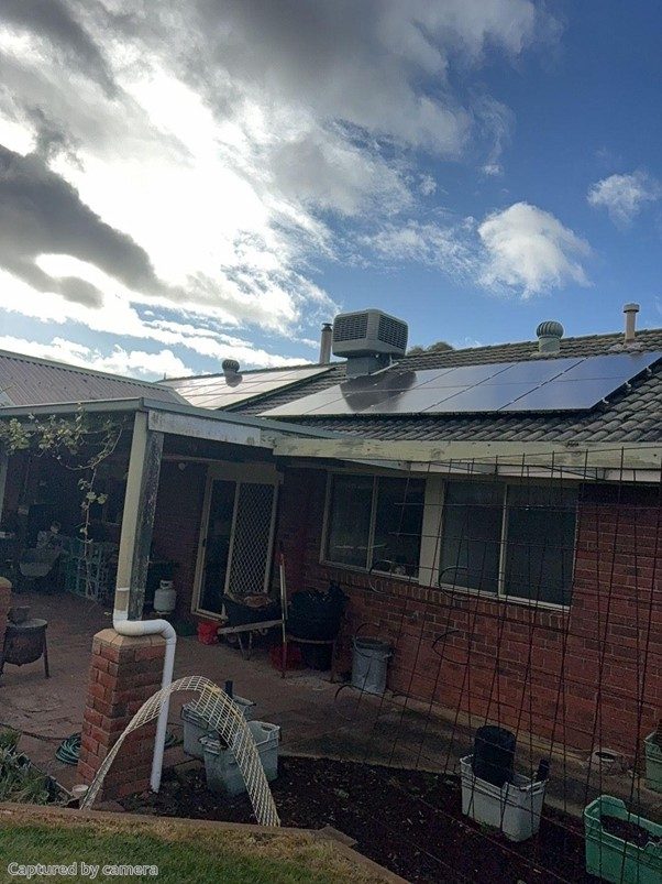Wide view of steven's bittern home with the new and existing solar arrays across the roof