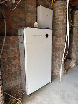 Sigenergy sigenstor battery and gateway on the brick garage wall