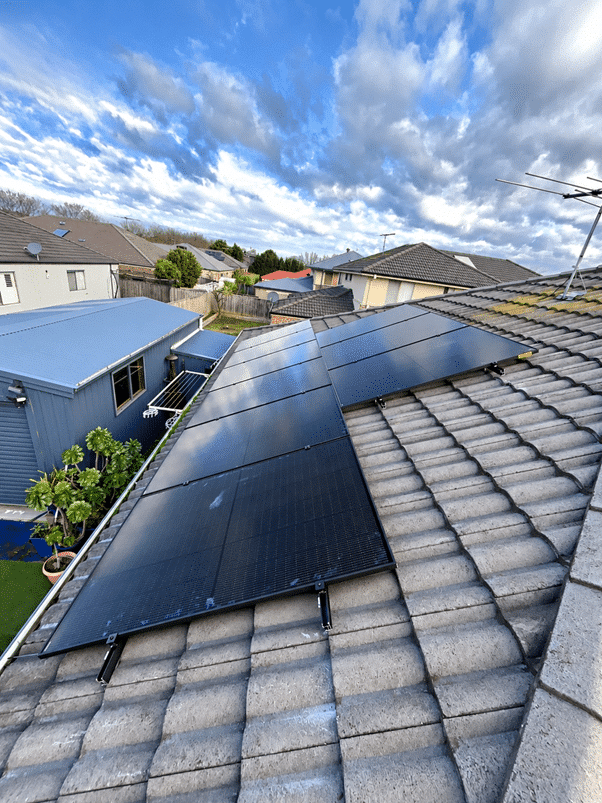 34 all-black jinko solar panels across a tile roof in berwick