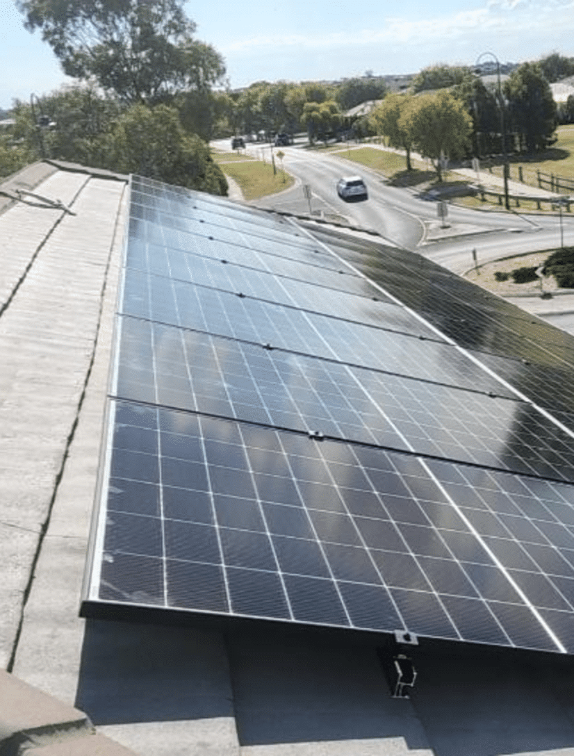All-black jinko solar panels being installed on a tile roof in berwick