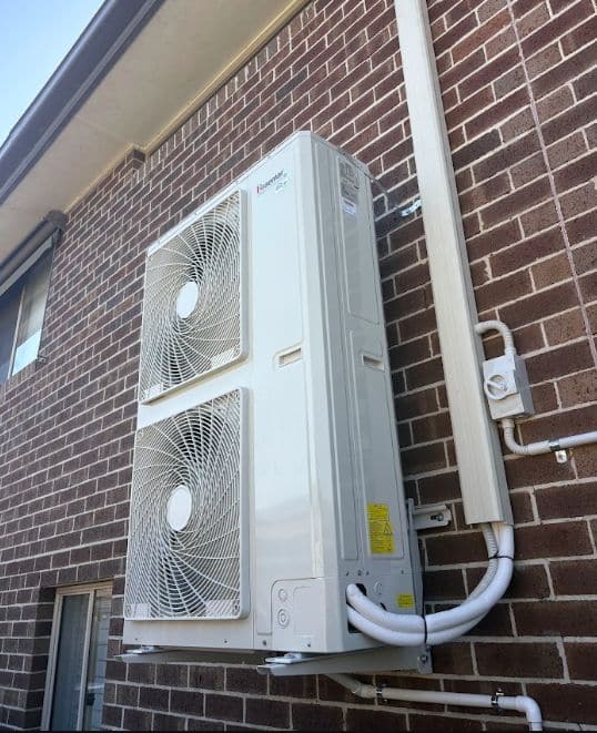 Braemar dominator outdoor unit wall-mounted on a brick veneer home in berwick