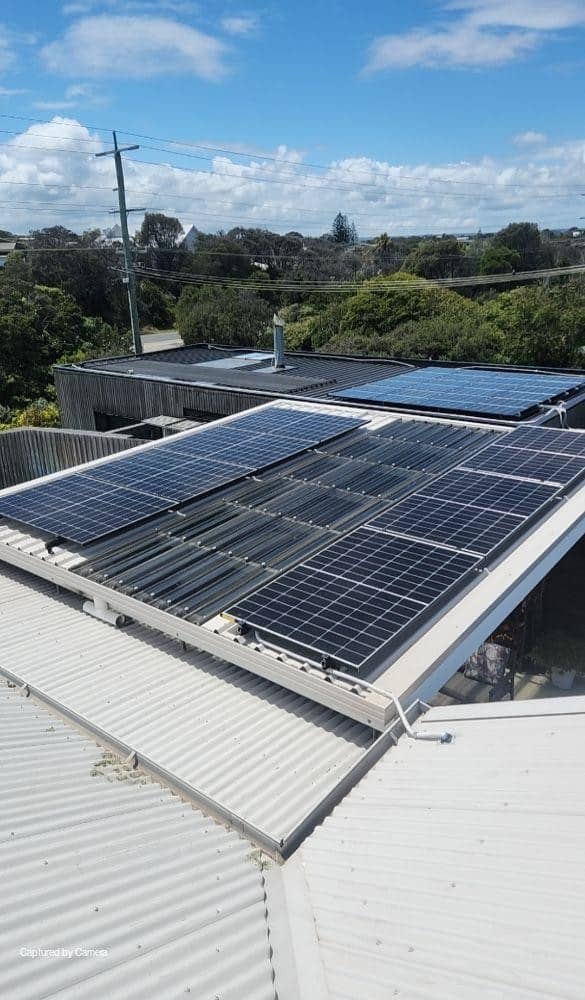 Aerial view of jinko tiger neo panels on the tin roof of a blairgowrie home