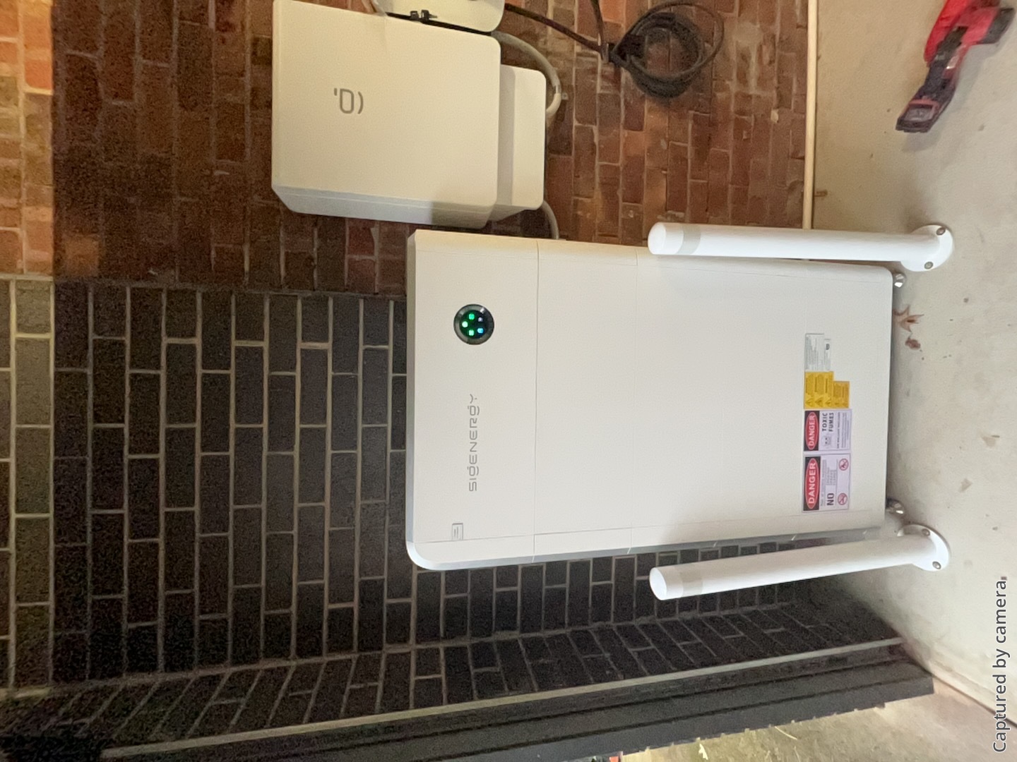 Ev Chargers Mornington 1 Sigenstor battery and sigen ev charger on a garage wall in camberwell, installed by powerband electrical
