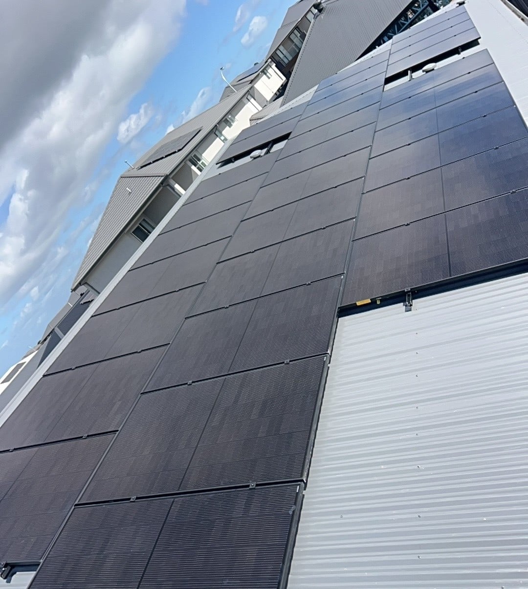 Jinko solar panels on the tin roof of a new double-storey home in clyde north