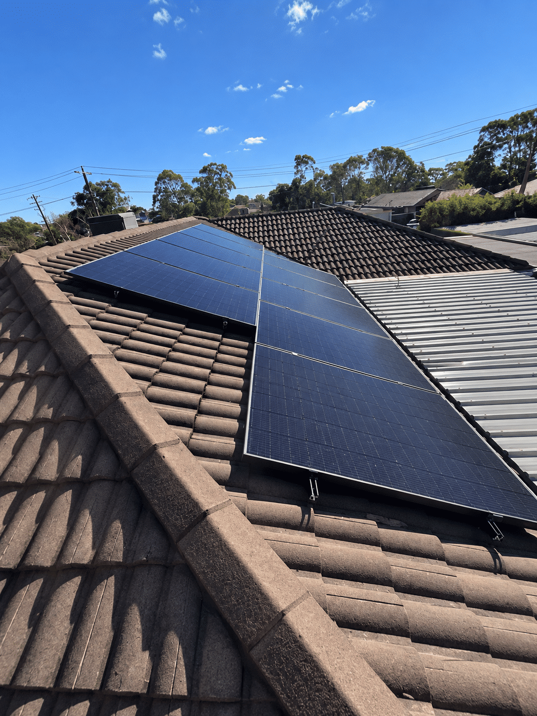 Jinko solar panels on a tile roof in cranbourne north with a second roof plane behind