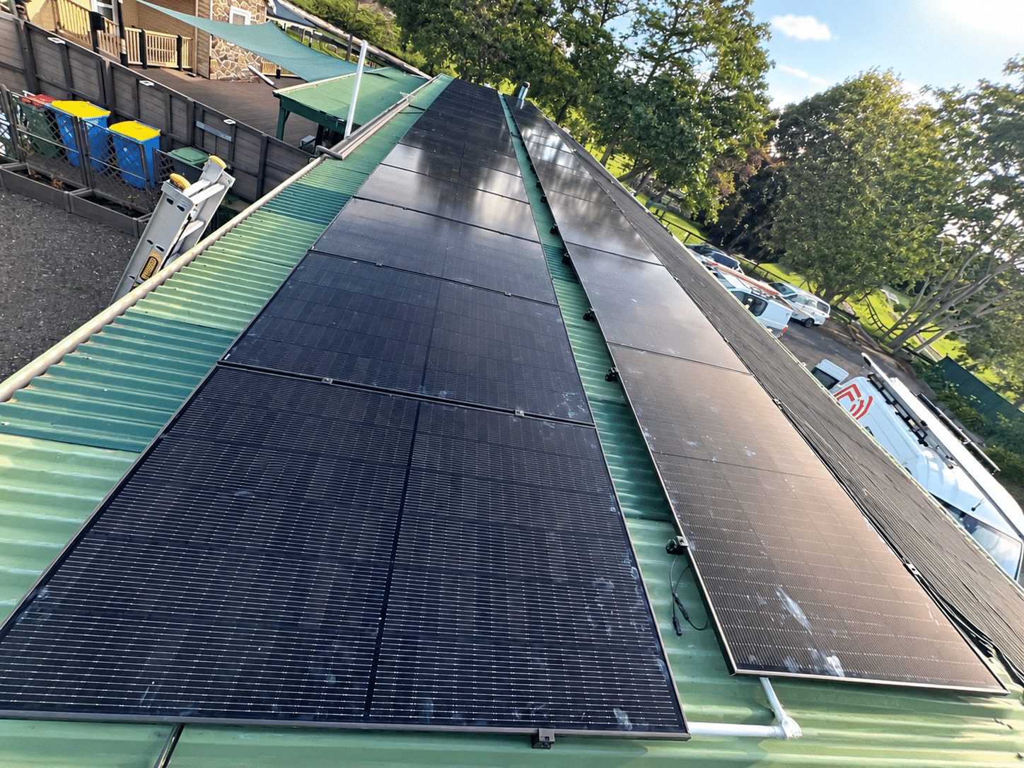 Jinko solar panels across a large shed roof in cranbourne south