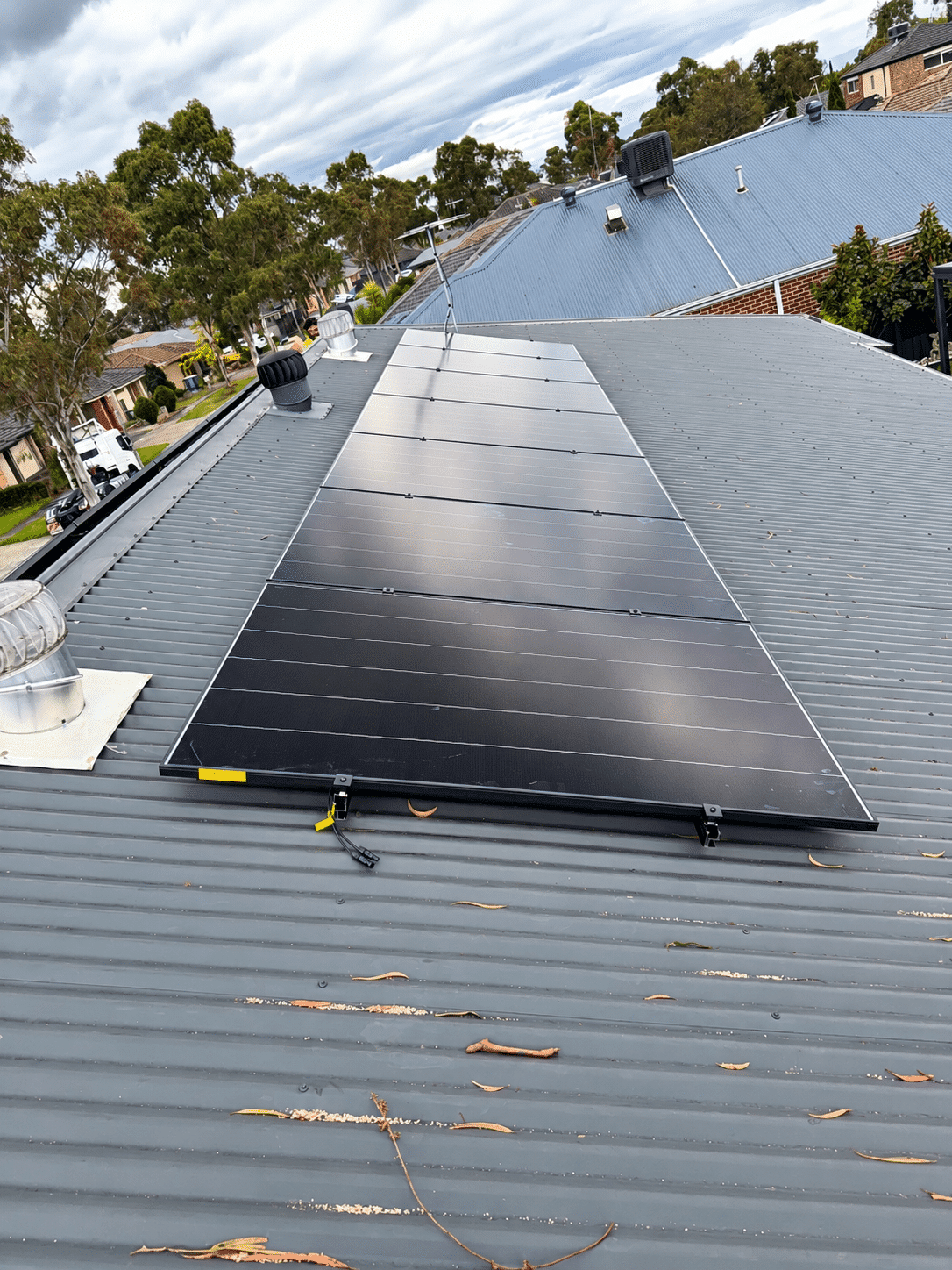 Aiko solar panels on a cranbourne west roof, installed with a reclaim heat pump by powerband electrical