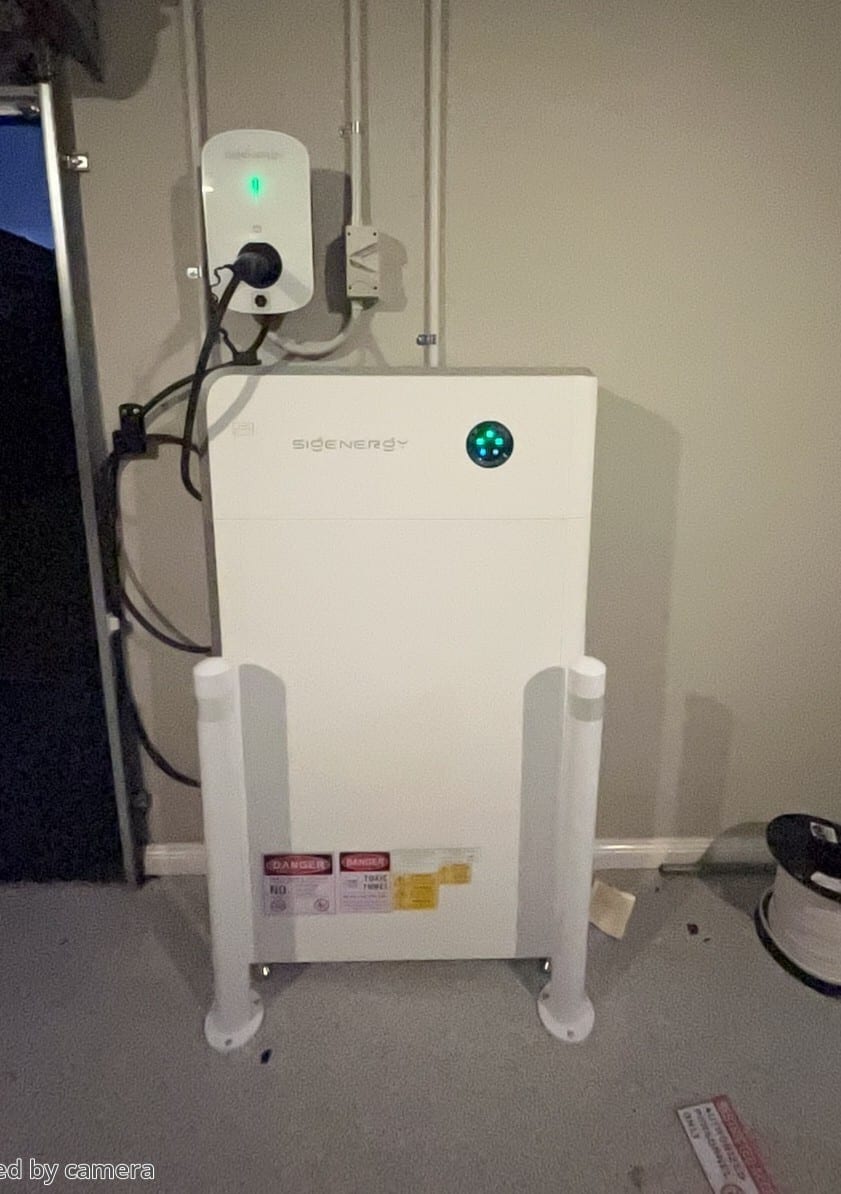 Sigenergy battery and sigen ev charger mounted together on a garage wall in doncaster east