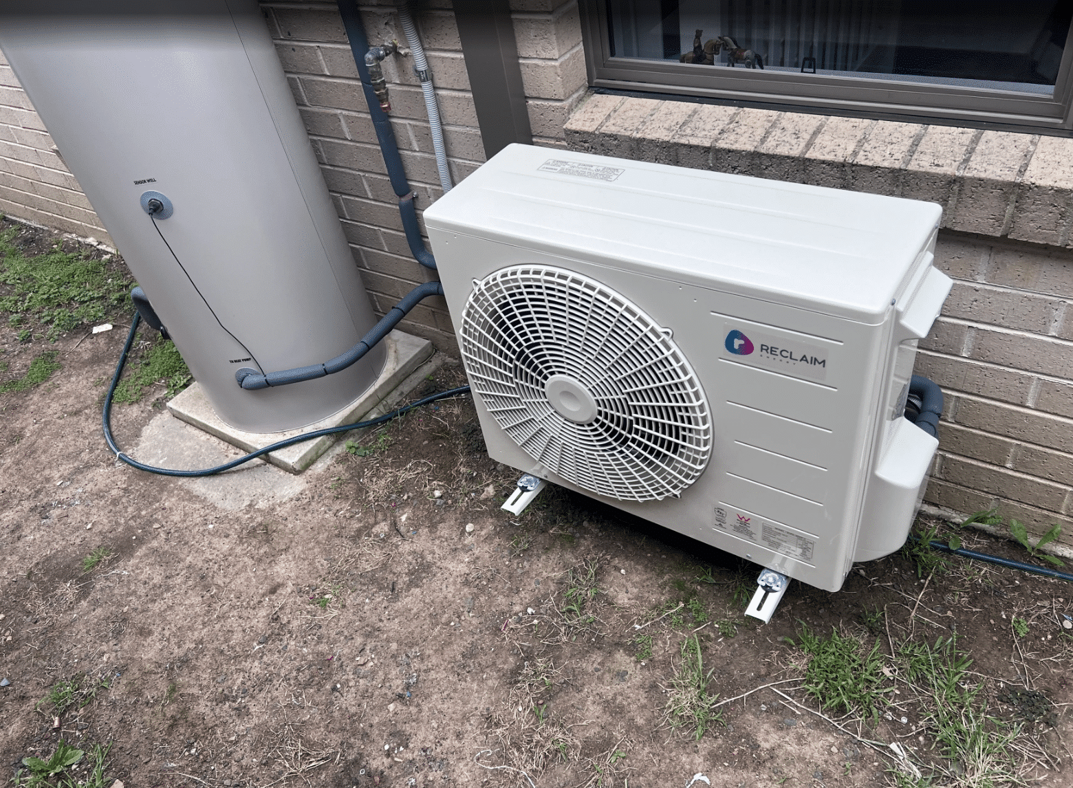 Reclaim co2 heat pump hot water unit outside a home in doreen