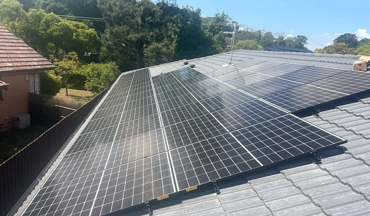 Thirty-eight jinko solar panels across a tile roof in ferntree gully