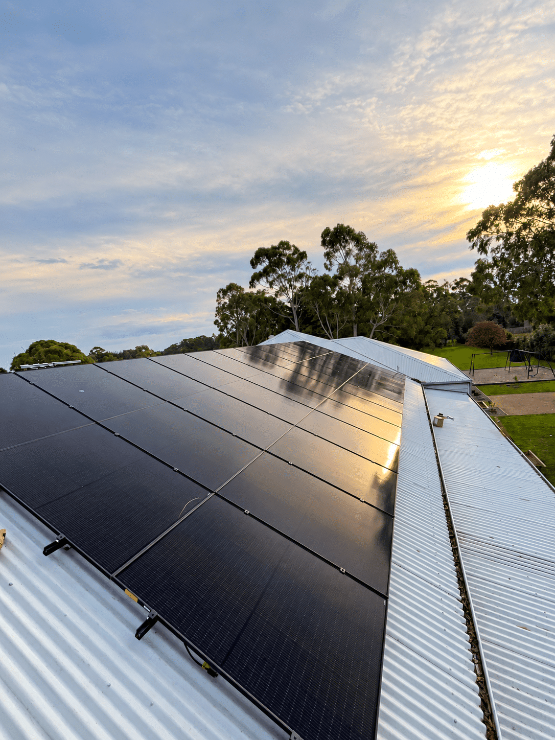 Jinko solar array across the roof of a family home in langwarrin at sunset