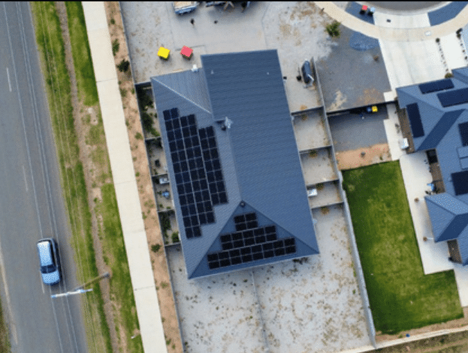 Aerial view of a solar array on the roof of a nine-bedroom property in shepparton