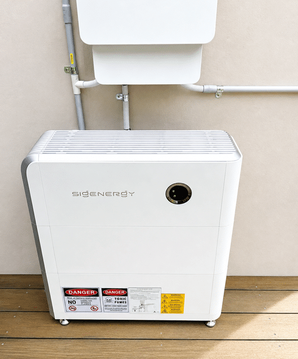 Sigenergy hybrid inverter and battery mounted on a timber deck wall in st andrews beach