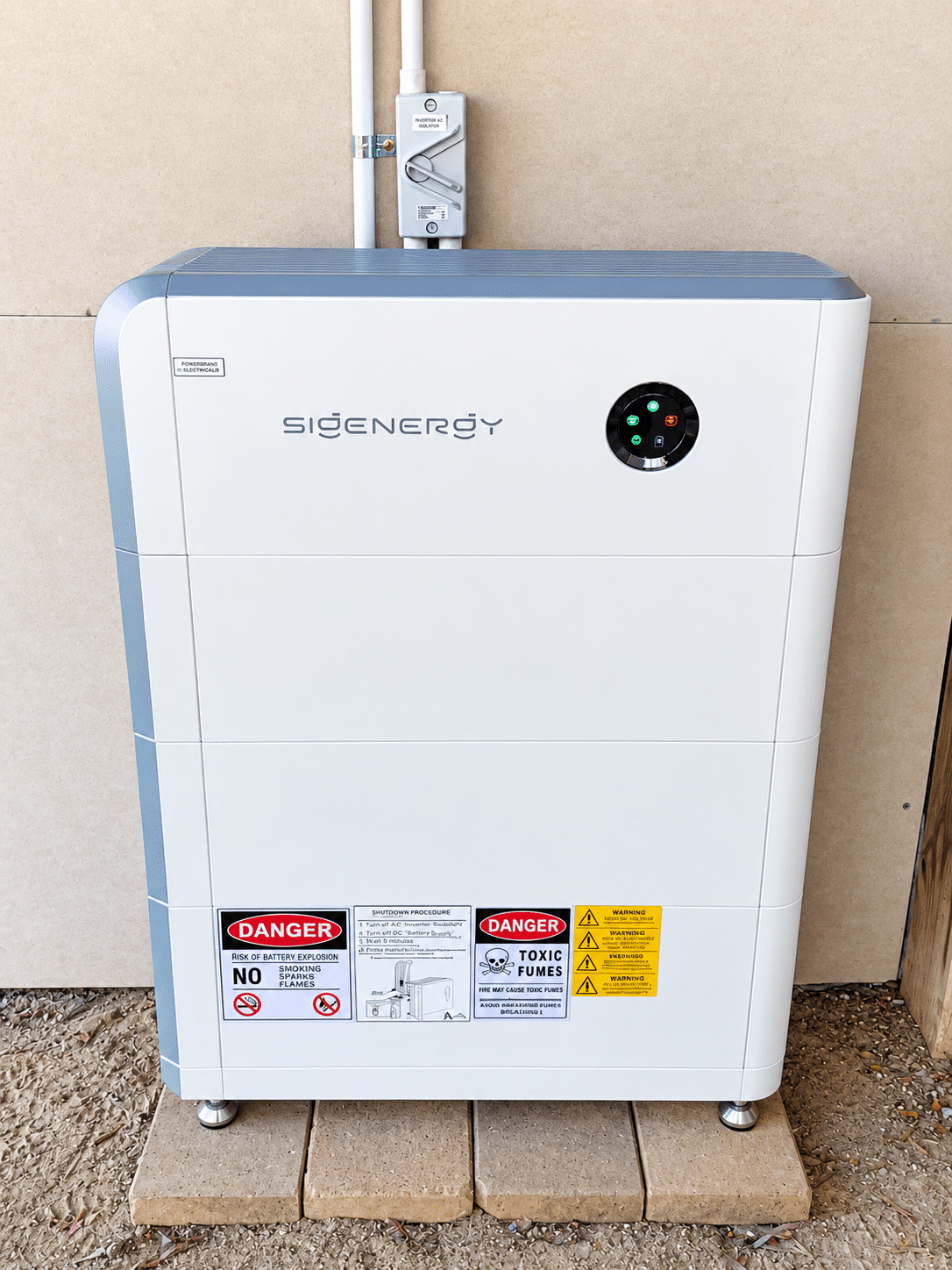 Sigenergy sigenstor battery module mounted on the outside wall of a st andrews beach home