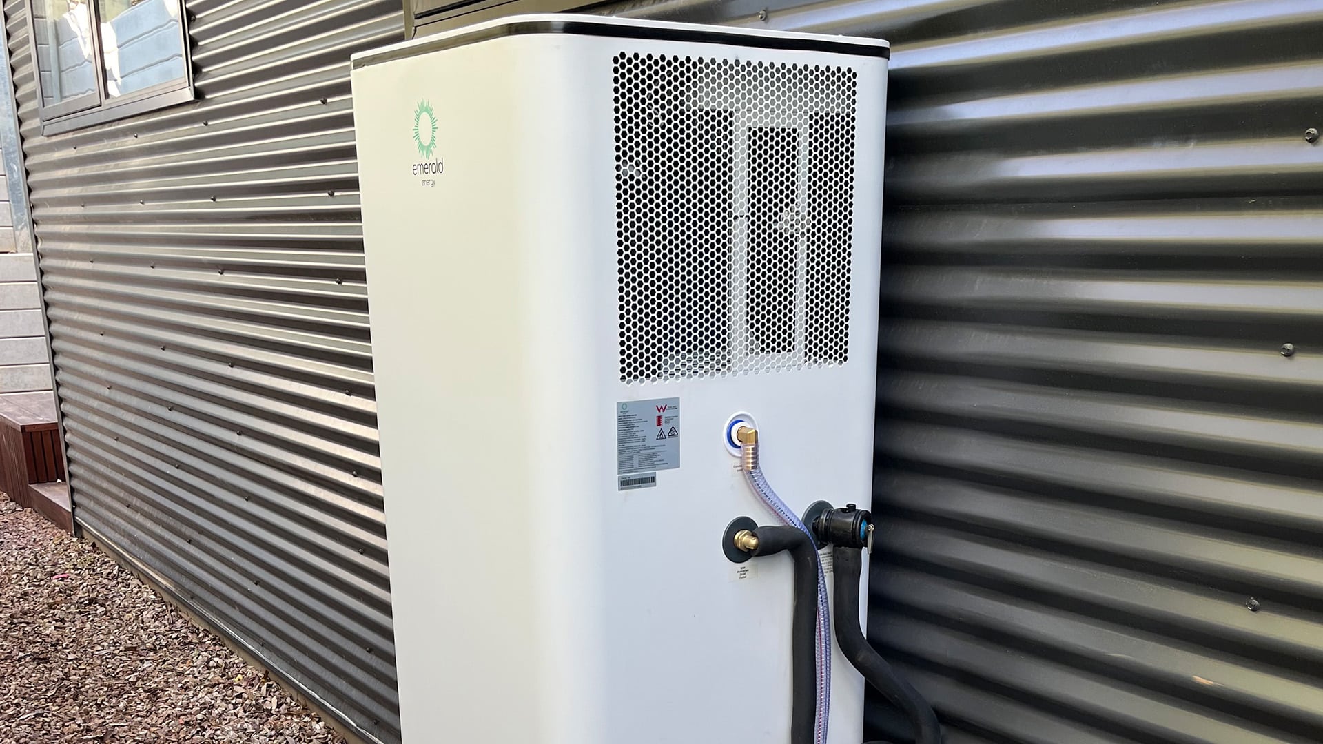 Istore heat pump hot water unit installed beside a melbourne home